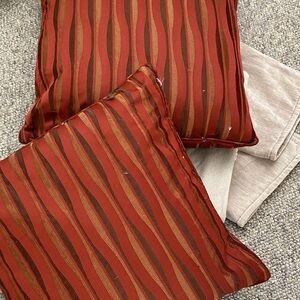 In excellent condition 2 Striped burgundy Throw Pillows